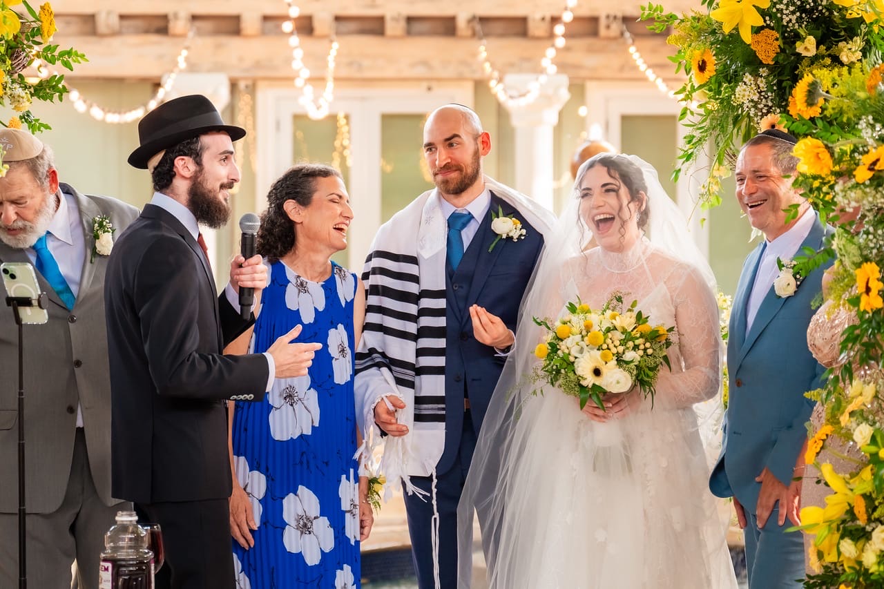 Rabbi Yosef officiating a wedding ceremony