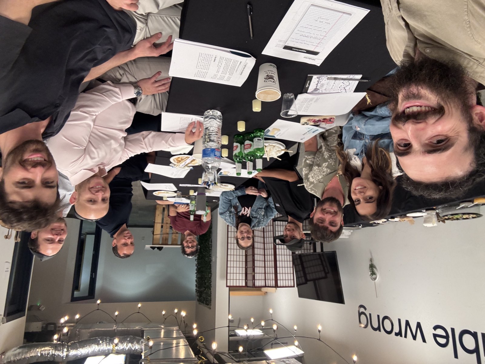 Group learning together around a table over sushi